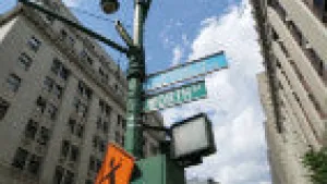 Pan to Street Sign in New York City (L to R)