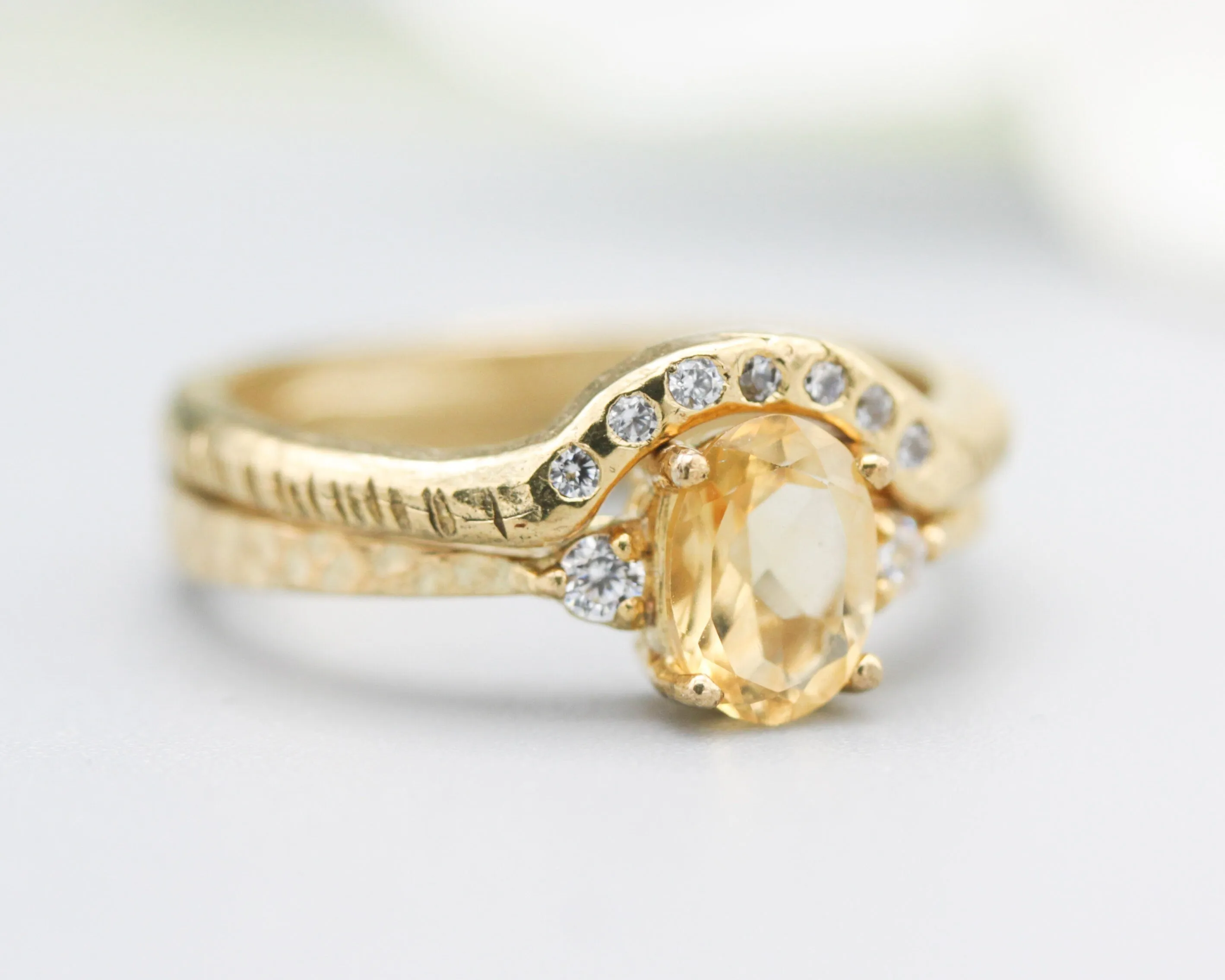 Set of 2 Oval faceted citrine ring with tiny round diamonds side set with 14k gold band ring with tiny 7 diamond on the center