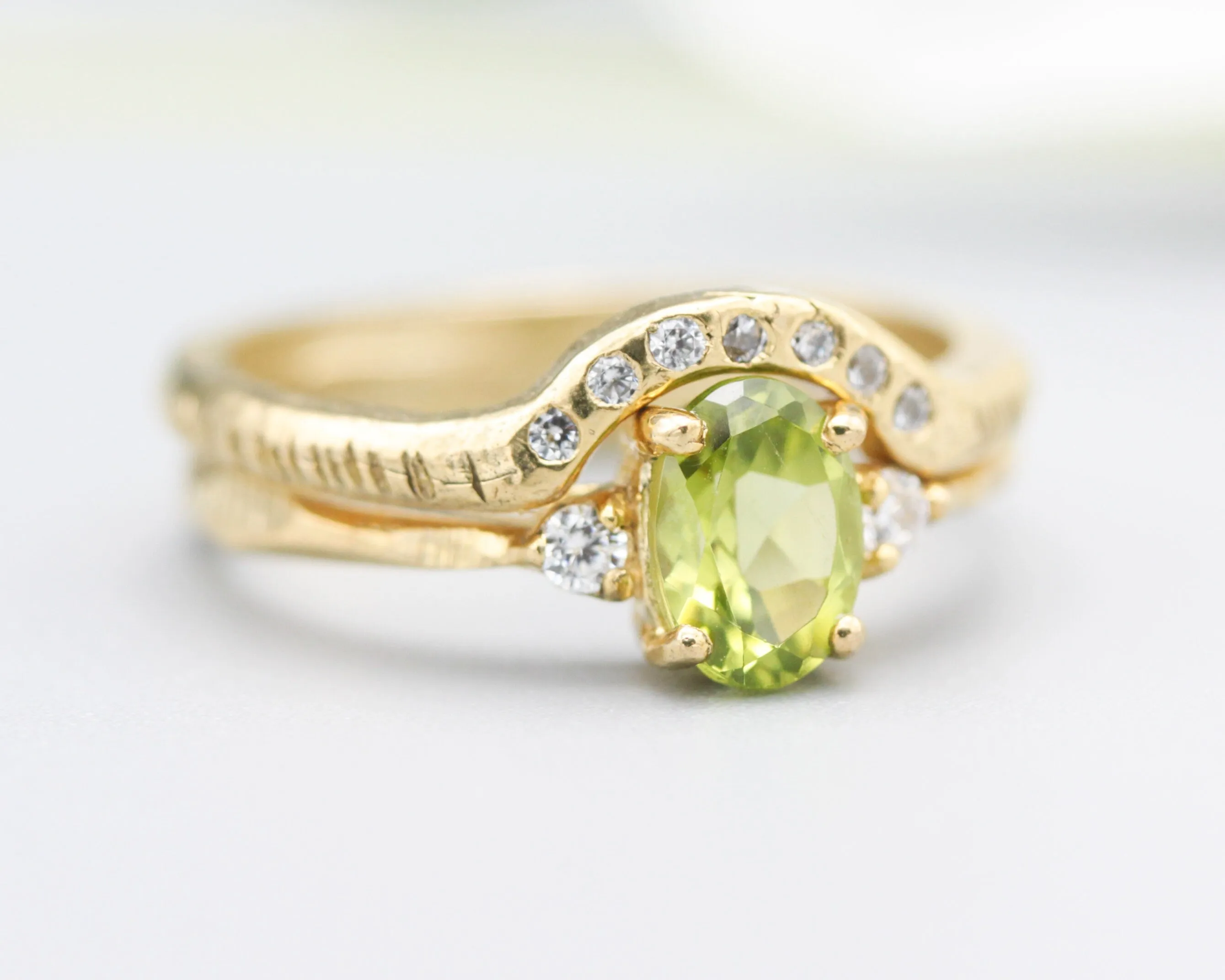 Set of 2 Oval faceted peridot ring with tiny round diamonds side set with 14k gold band ring with tiny 7 diamond on the center