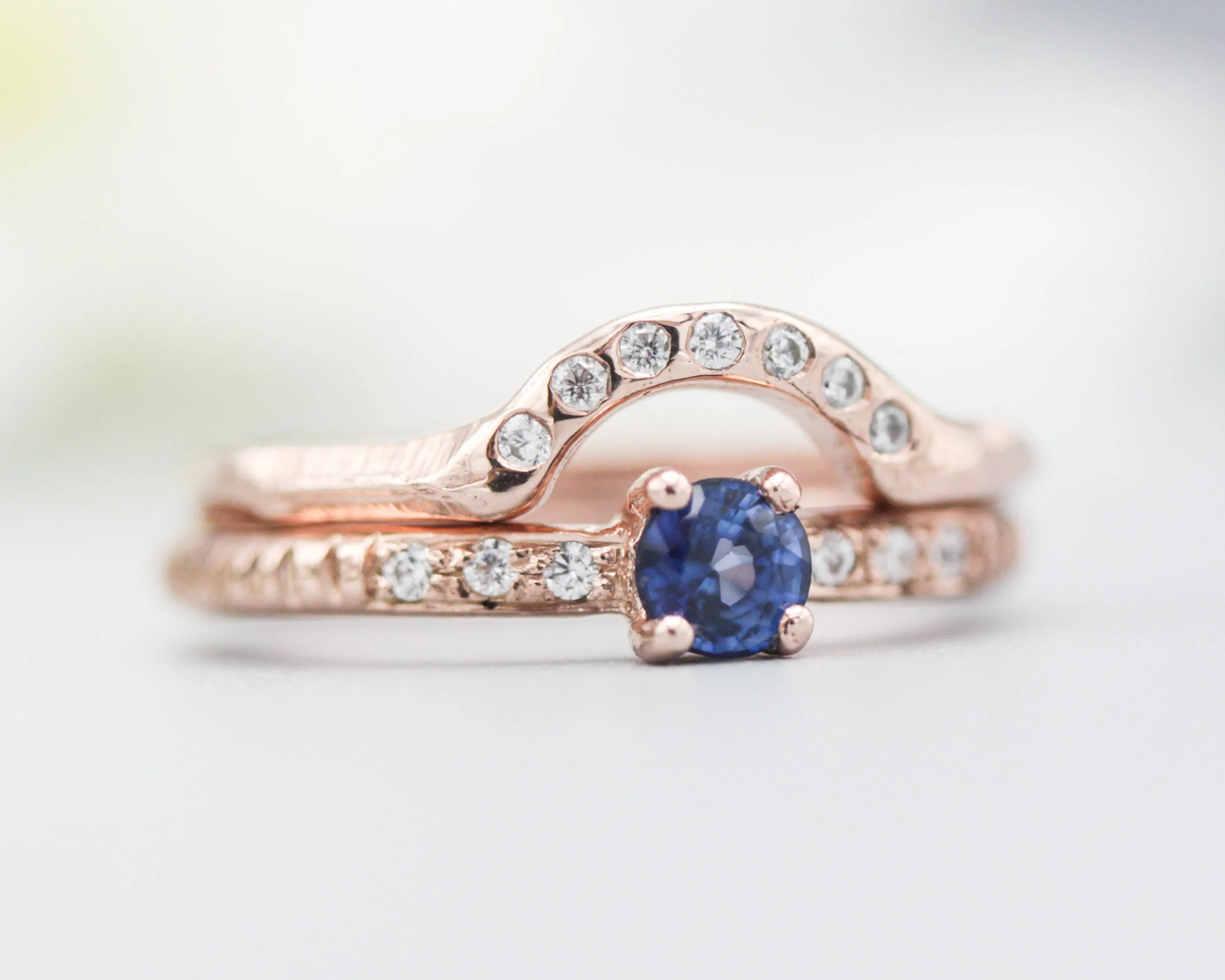 Set of 2 Round faceted blue sapphire ring with tiny diamonds on 14k Rose gold band set with 14k rose gold ring with 7 diamond on the center