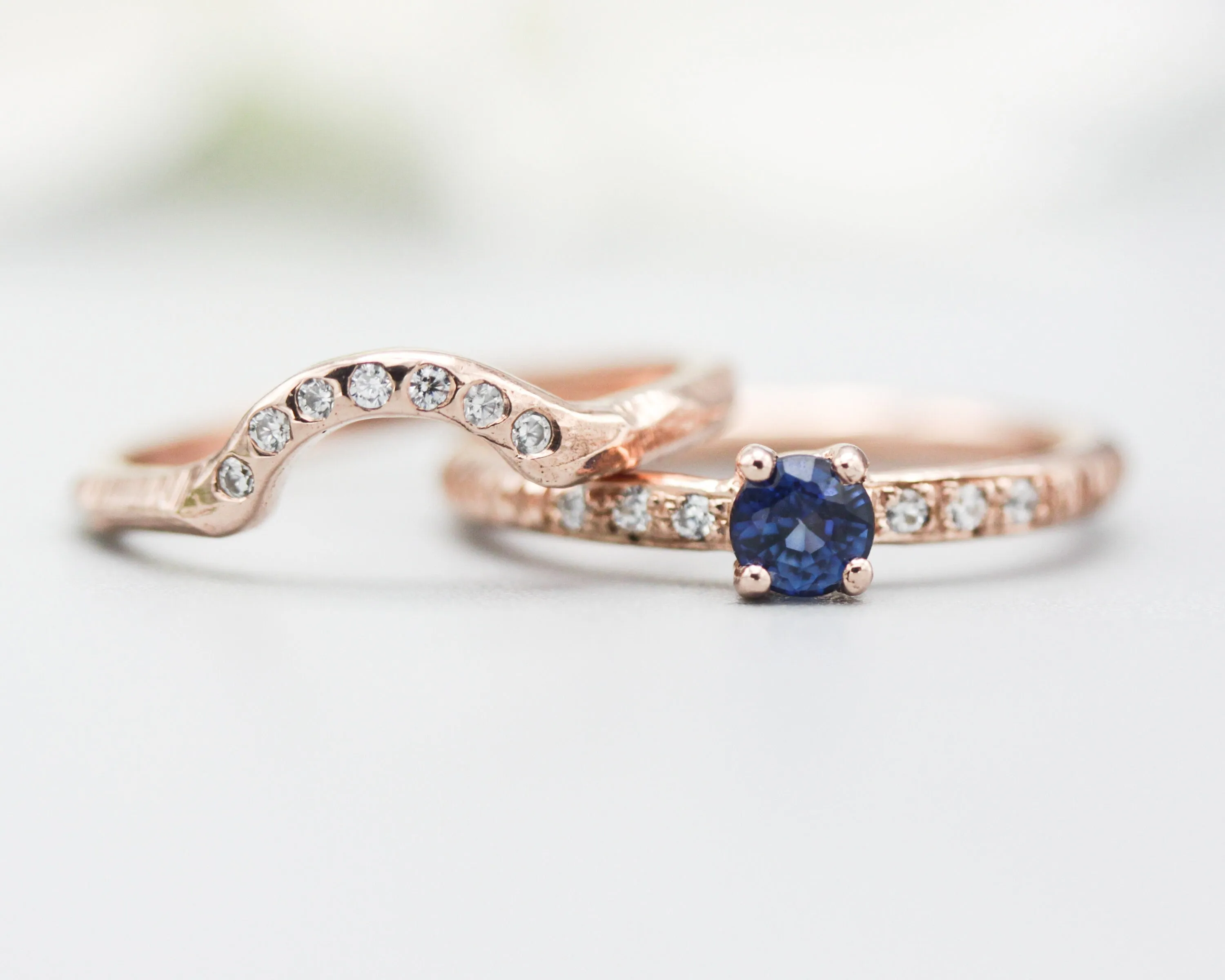 Set of 2 Round faceted blue sapphire ring with tiny diamonds on 14k Rose gold band set with 14k rose gold ring with 7 diamond on the center