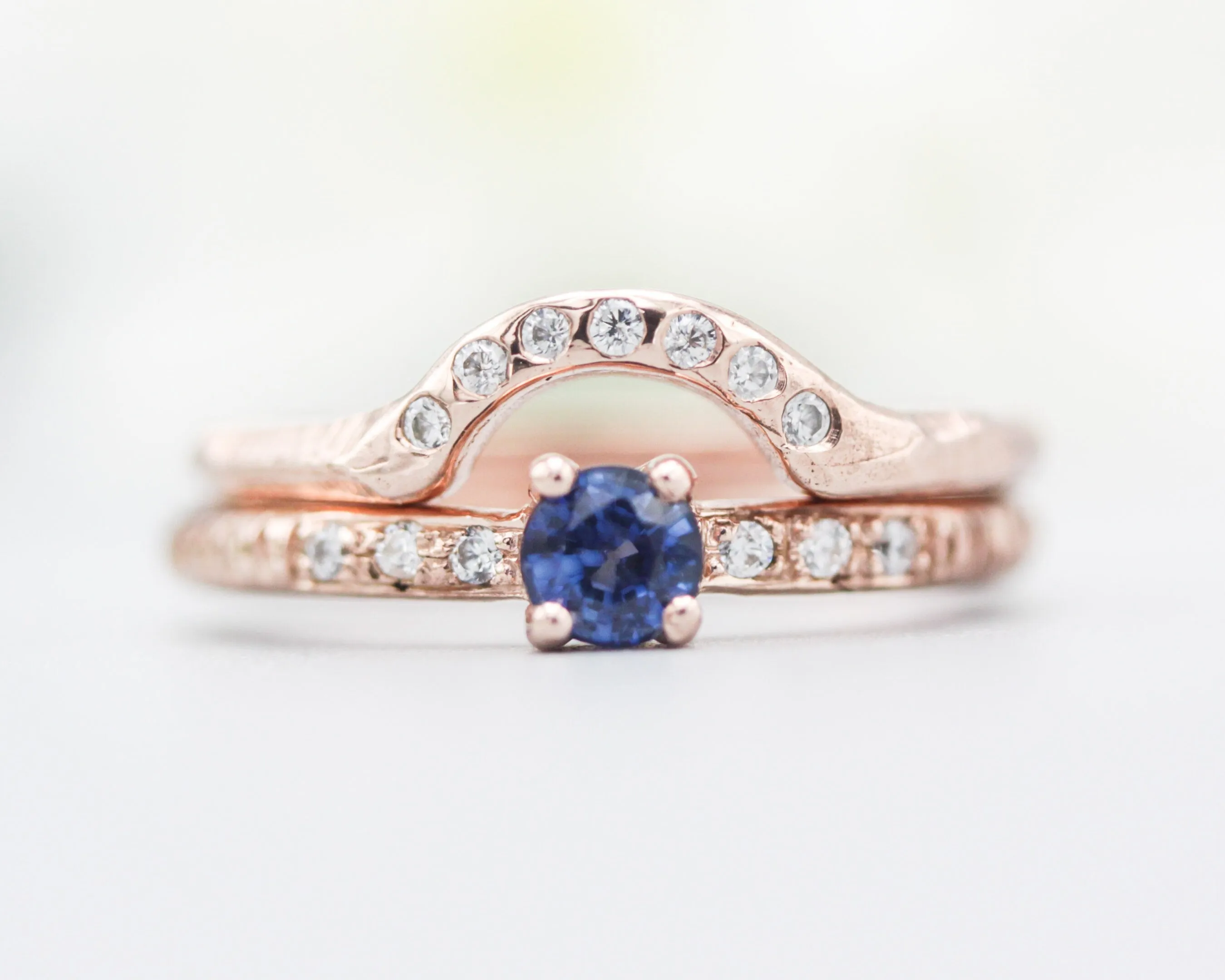 Set of 2 Round faceted blue sapphire ring with tiny diamonds on 14k Rose gold band set with 14k rose gold ring with 7 diamond on the center