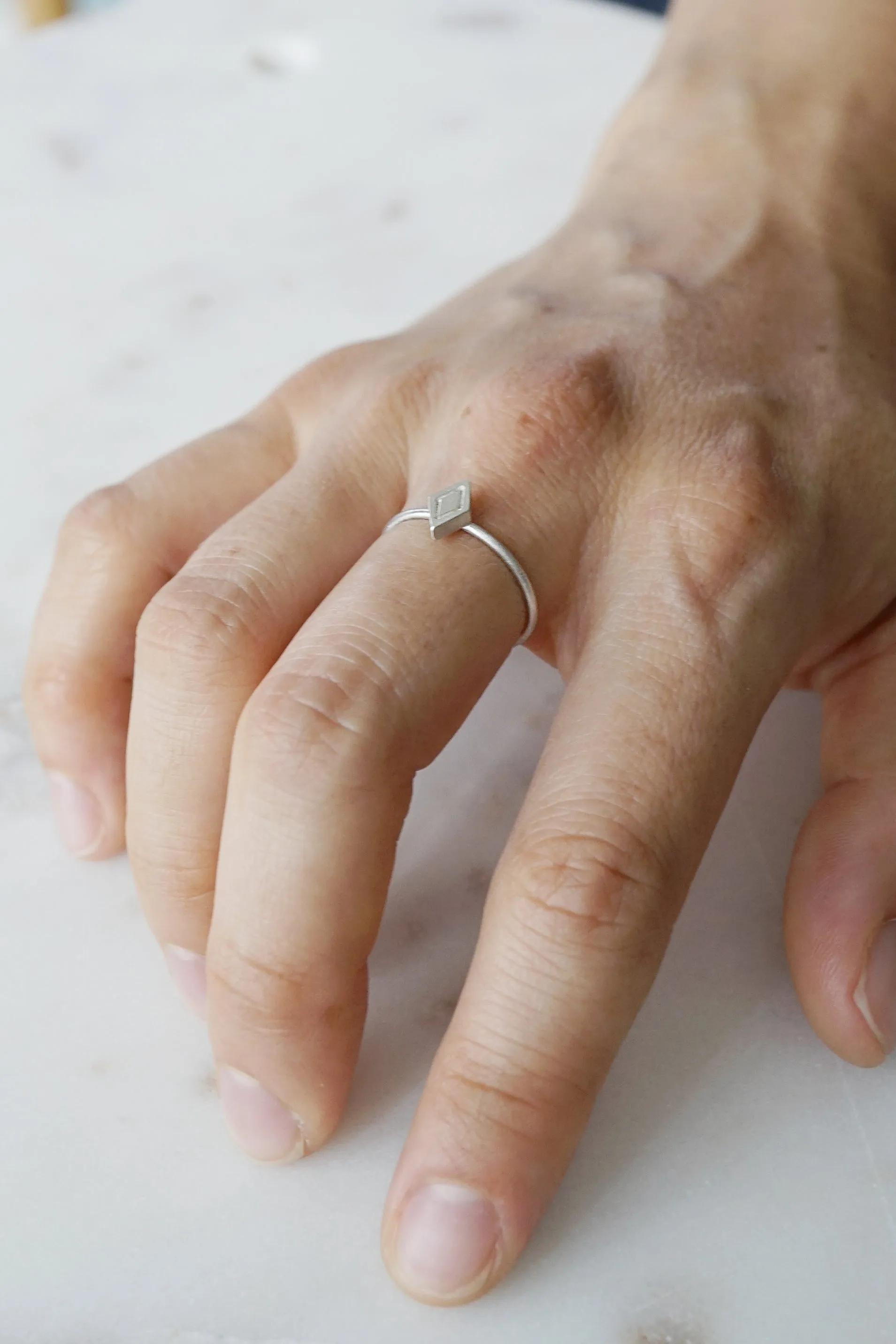 Tiny shield ring